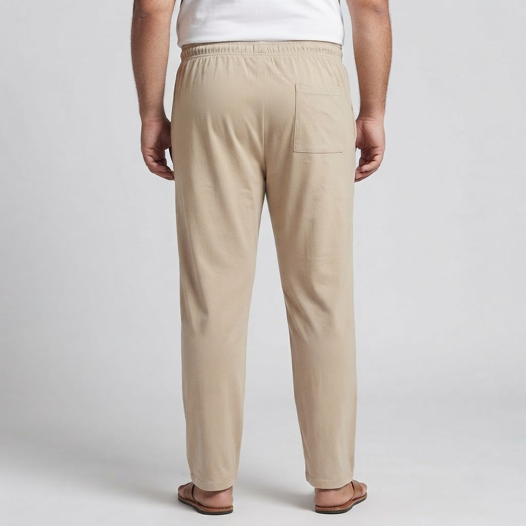 Beige elastic waist jersey cotton trousers for men, designed for comfortable everyday and casual wear.