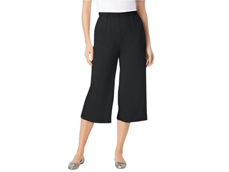 Black knit culotte capri pants on hanger showing pleat detail and drape