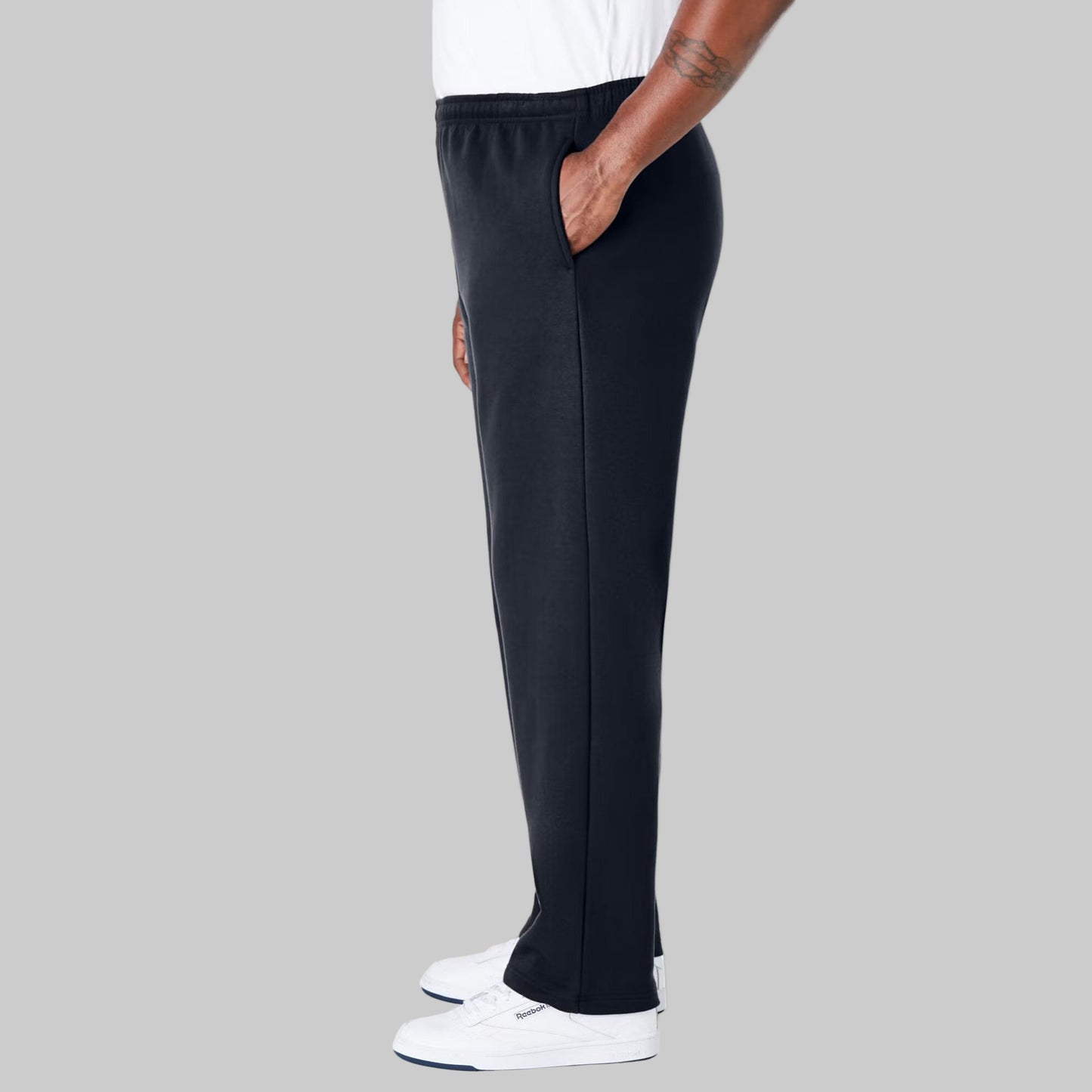 Black fleece open-bottom sweatpants for plus-size men shown on a studio background, relaxed fit with side pockets and back pocket.