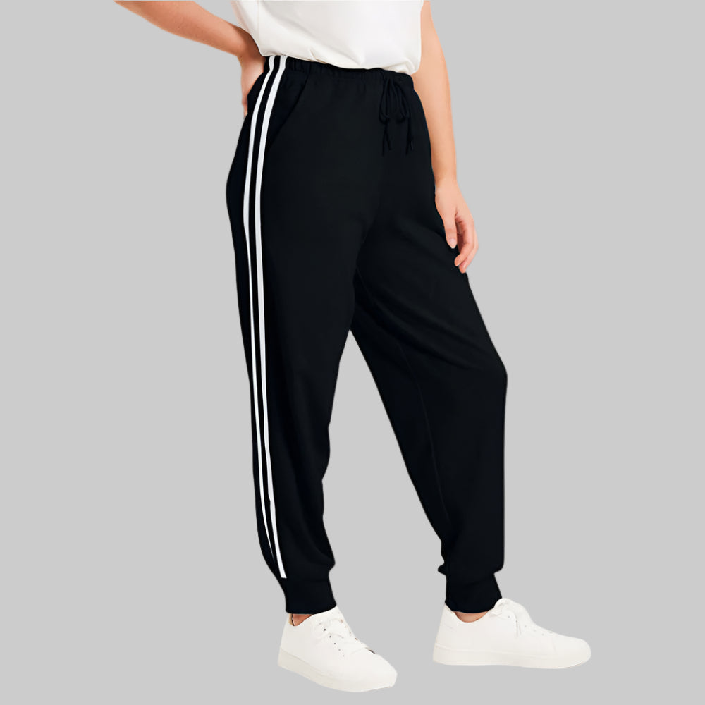 Black French Terry Jogger with side stripes and drawstring waist, laid flat