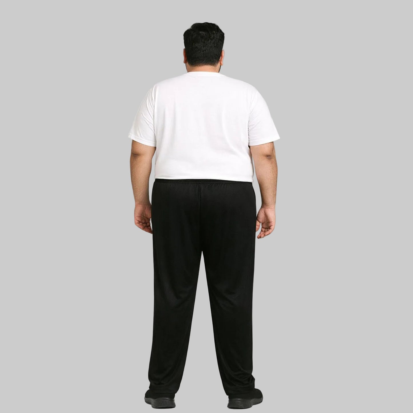 Black mesh polyester plus size trouser worn by a 2XL male model, featuring breathable fabric, elastic waistband, and a relaxed fit suitable for everyday wear