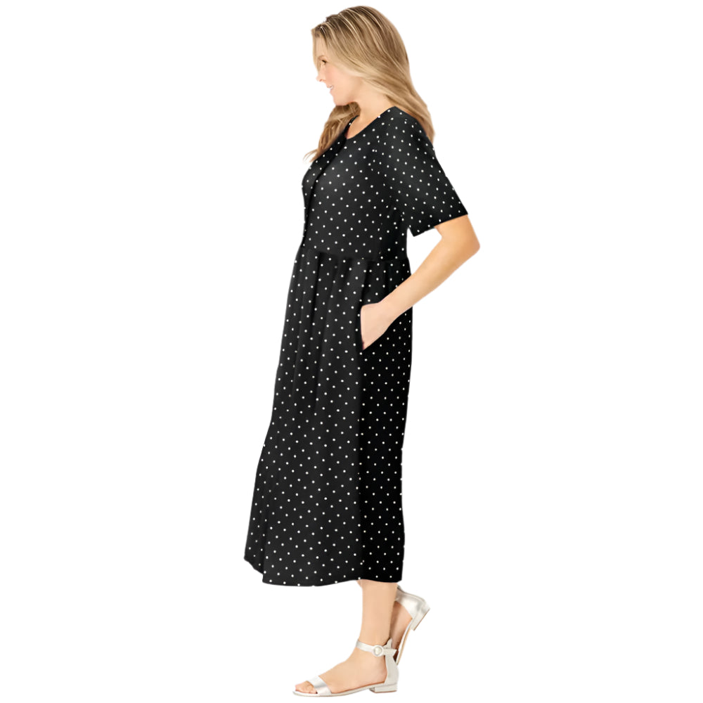 Woman wearing black polka dot button-front dress with gathered waist and flowing skirt