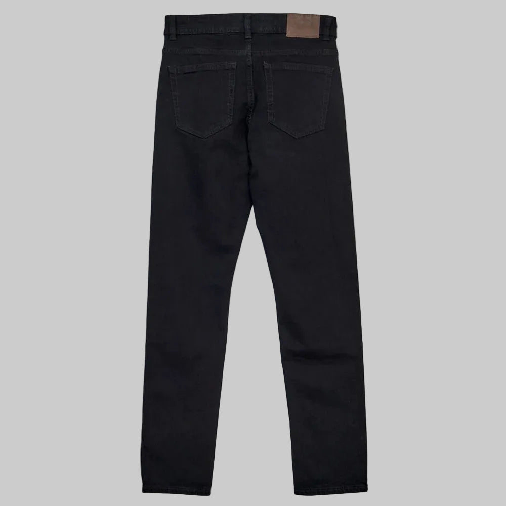 Men’s black slim fit stretch jeans with standard waist and slim leg, front studio view