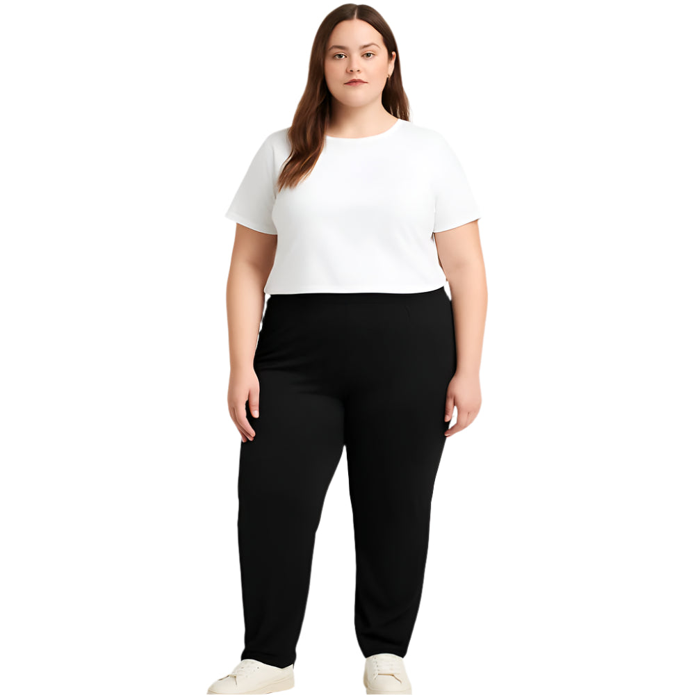 Plus size woman wearing high-rise black performance activewear leggings in studio