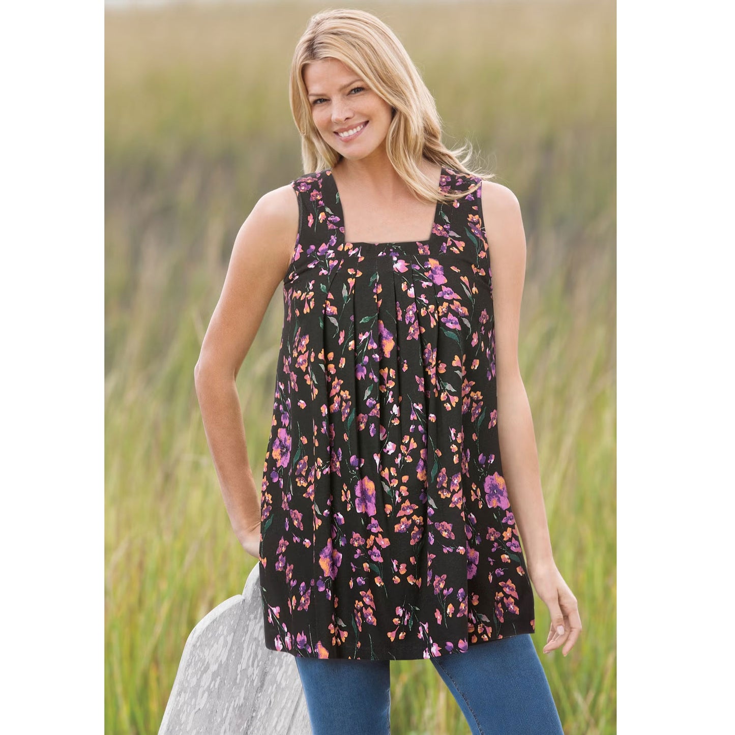Woman wearing black square neck swing tunic with front pleats and side pockets
