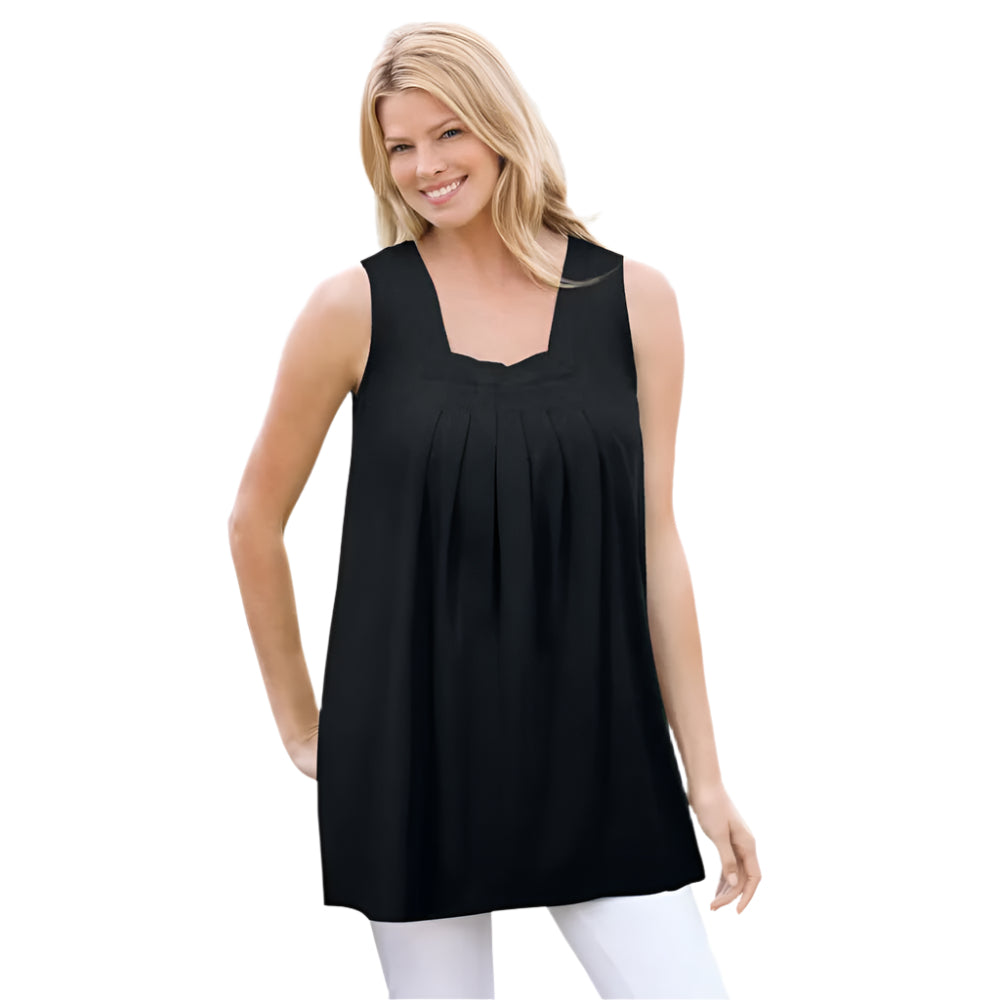 Woman wearing black swing tunic with square neckline, front pleats, and pockets