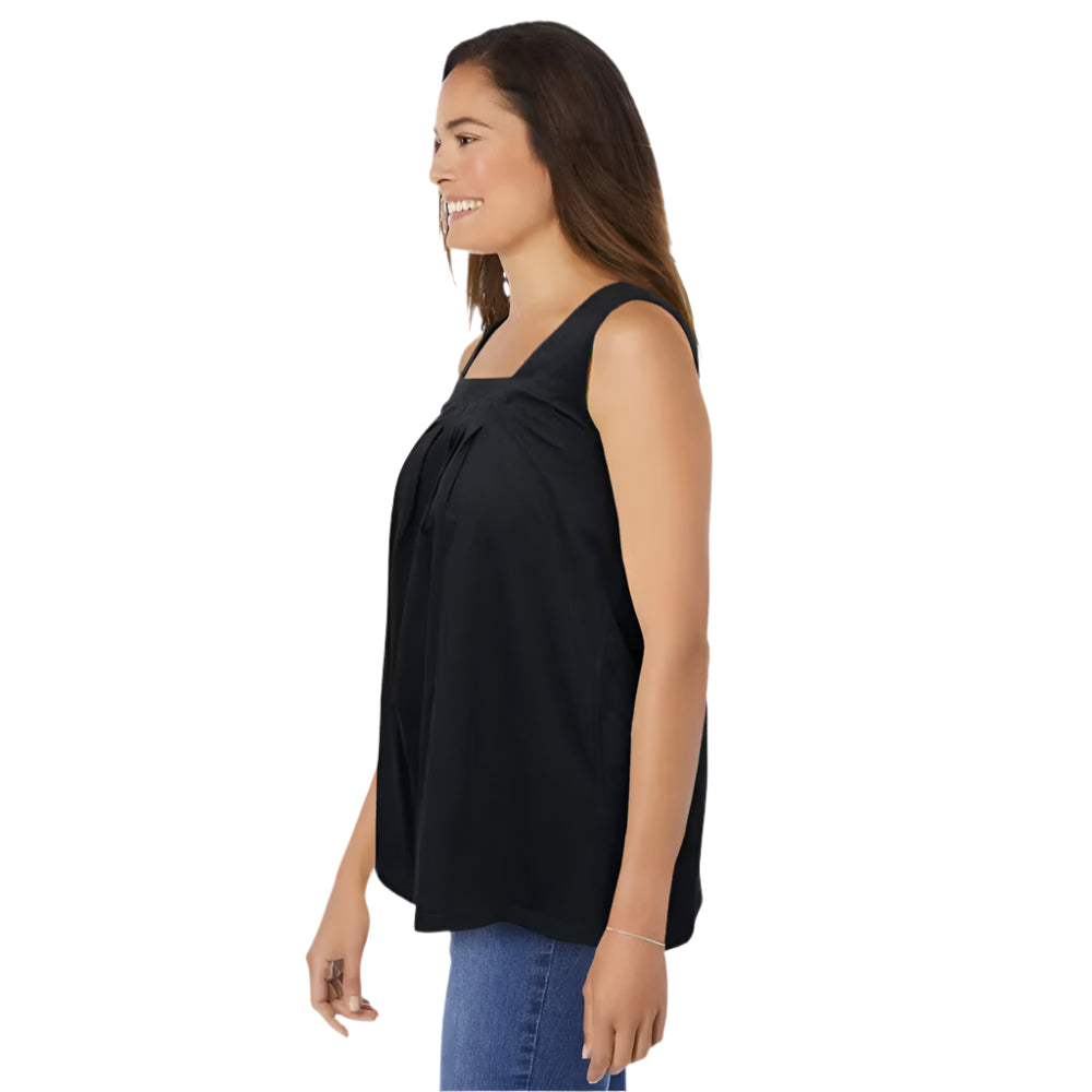 Woman wearing black swing tunic with square neckline, front pleats, and pockets