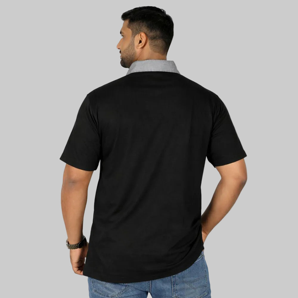 Plus size male model wearing black polo shirt with grey contrast collar front view