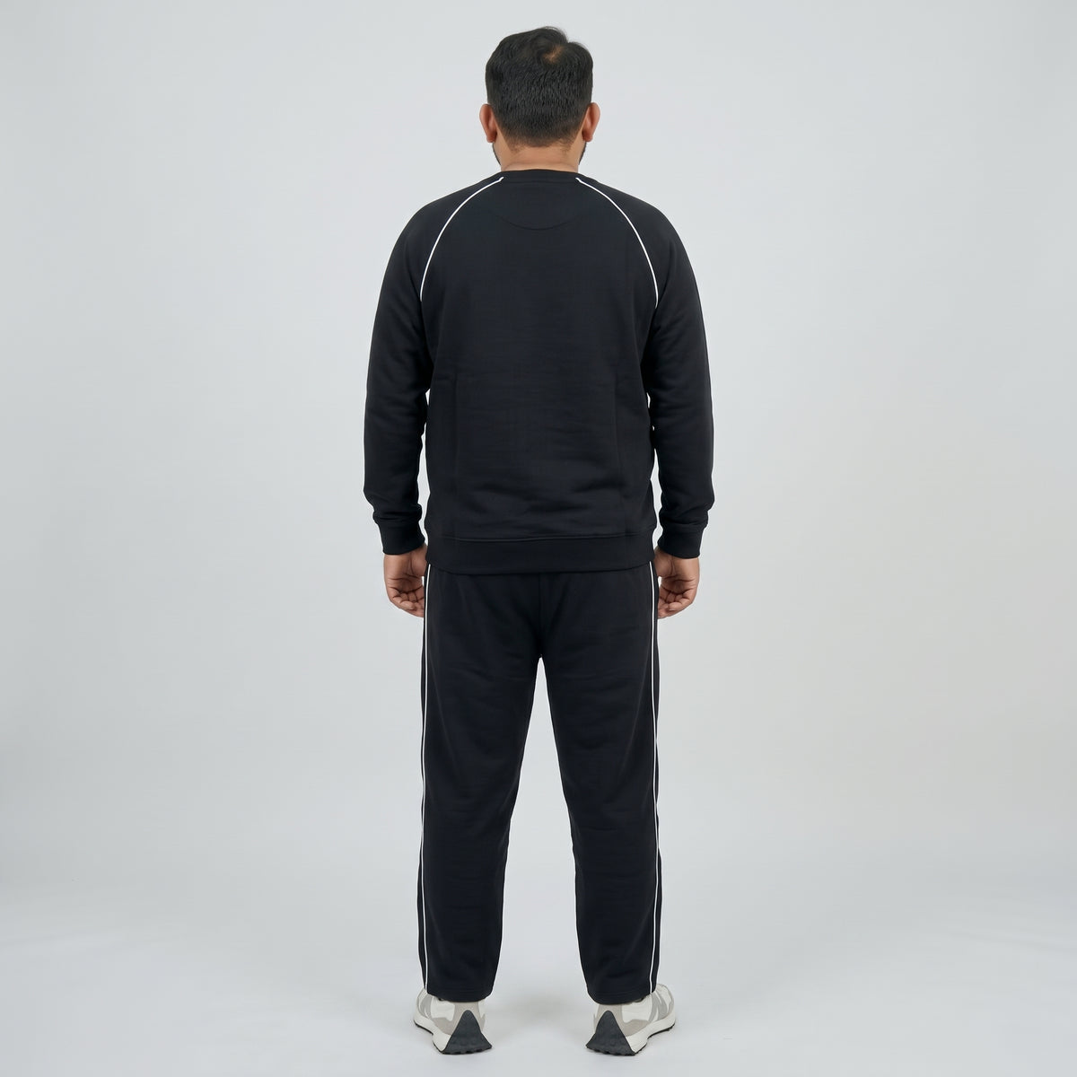 Black Embroidered Fleece Co-ord Set featuring a stylish embroidered top and matching trousers made from soft fleece fabric.