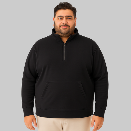Plus-size male model wearing black quarter-zip fleece sweatshirt with kangaroo pocket, front view on white background.