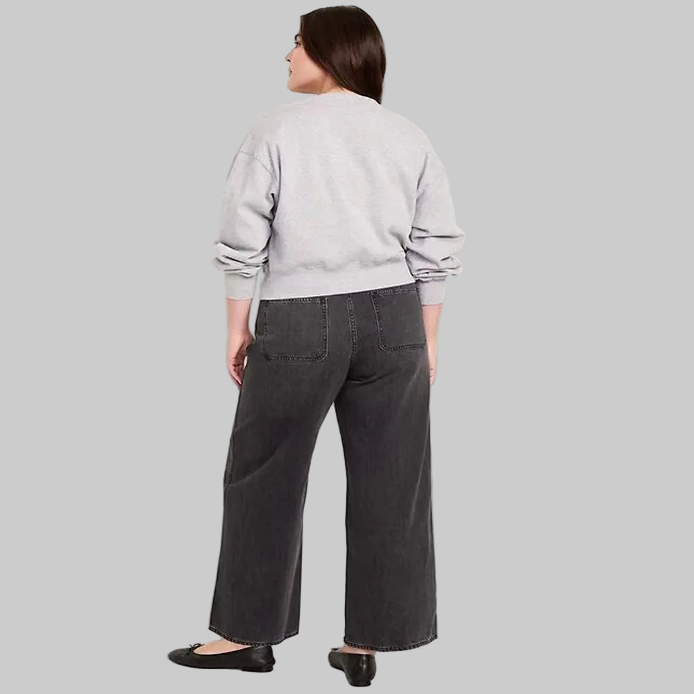 Women's black wash plus size high-waisted wide-leg denim jeans with a relaxed fit and wide-leg silhouette.