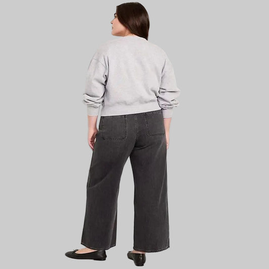 Women's black wash plus size high-waisted wide-leg denim jeans with a relaxed fit and wide-leg silhouette.