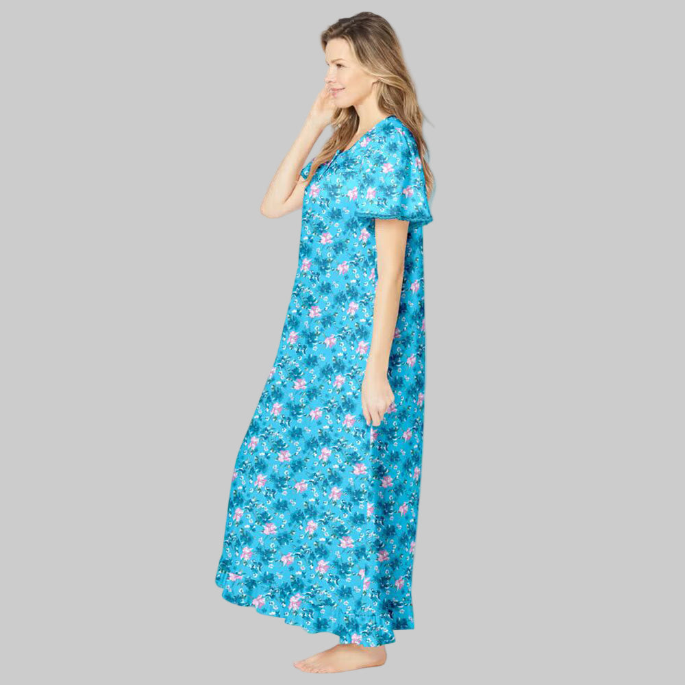Women’s plus size long cotton gown in Caribbean blue floral print with flutter sleeves, ruffled hem, and front pintuck detail.