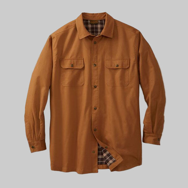 Plus-size man wearing a cedar brown flannel-lined twill shirt jacket with plaid inner lining, snap front, and flap chest pockets, photographed on a white studio background.