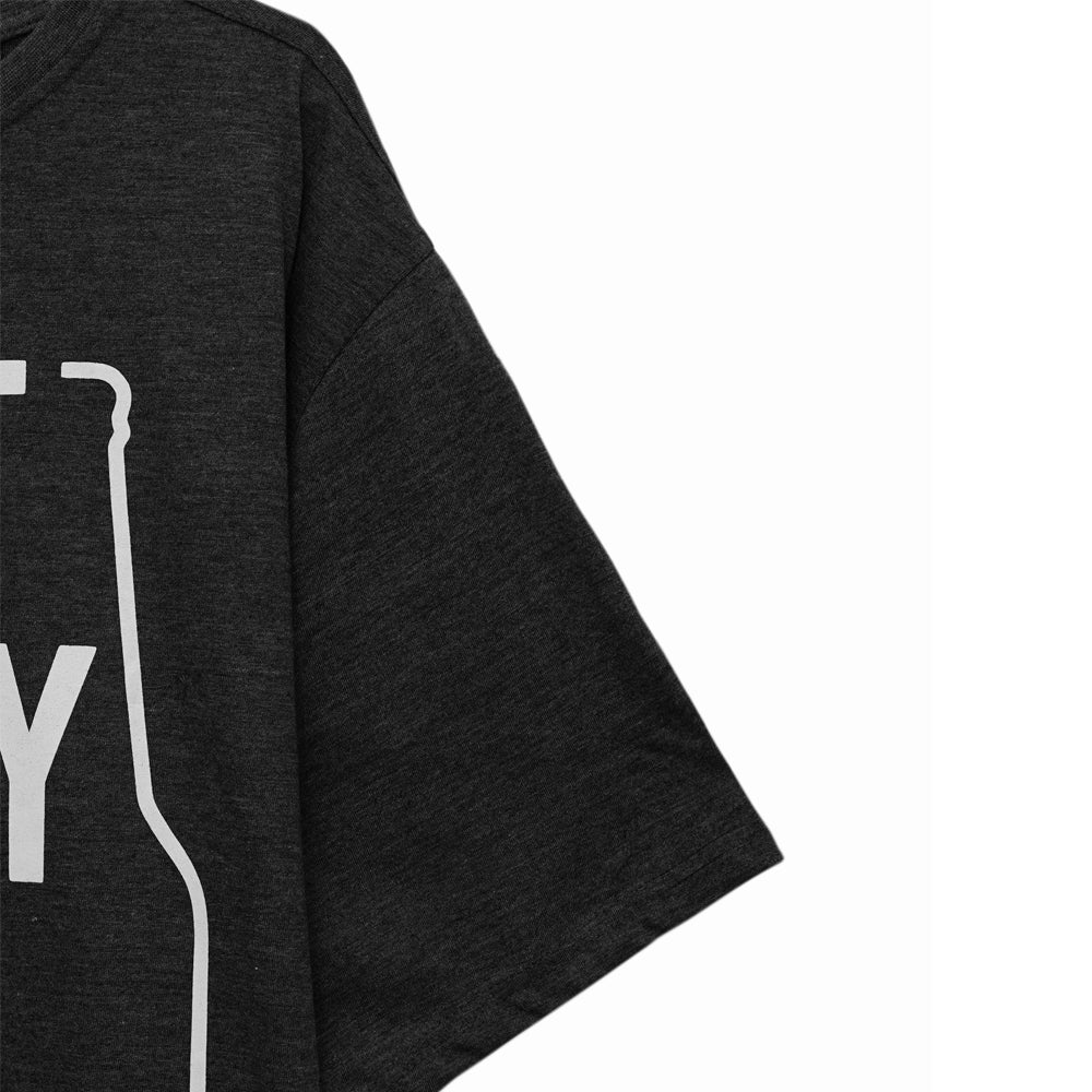 Man wearing charcoal crewneck t-shirt with “Don’t Worry” print