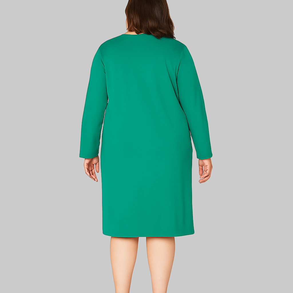 Plus size woman wearing a Cool Emerald Comfort Long Sleeve Sleepshirt in emerald green with long sleeves, knee-length cut, and printed graphic.