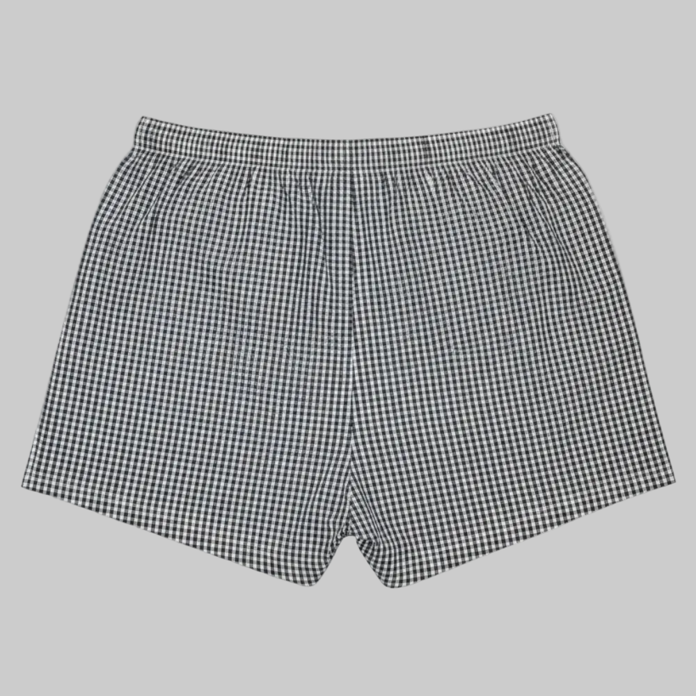 Classic black and white gingham cotton boxer with elastic waistband and button fly, laid flat showing a clean and comfortable everyday design
