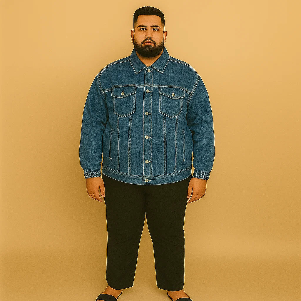 Plus-size man wearing classic blue denim jacket with elastic cuffs and chest flap pockets