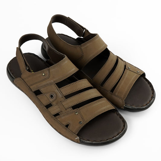 Close-up of stitching and rivet details on brown leather sandal – PlusSize.pk