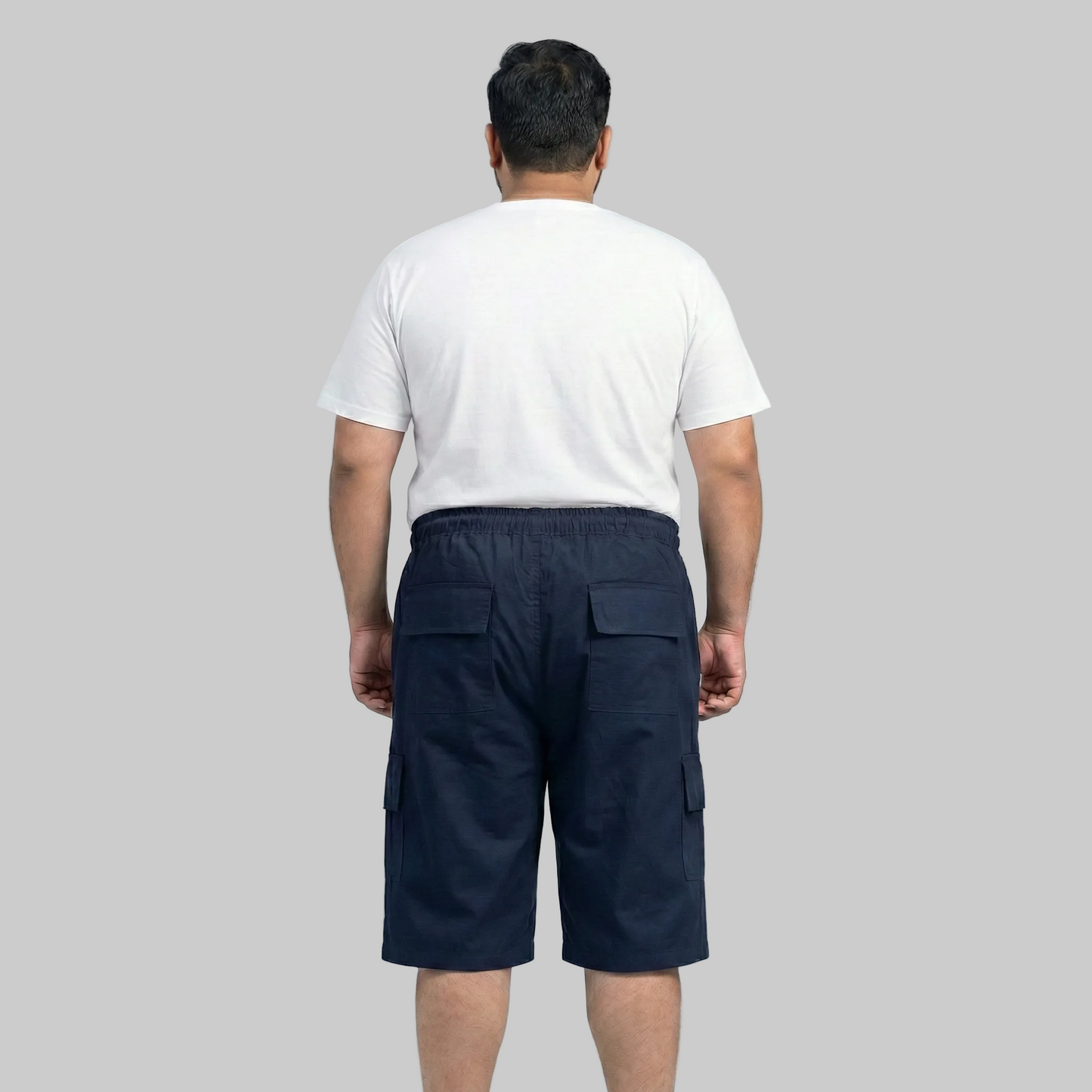 Men wearing classic navy cotton elastic waist cargo shorts with drawstring and side pockets front view
