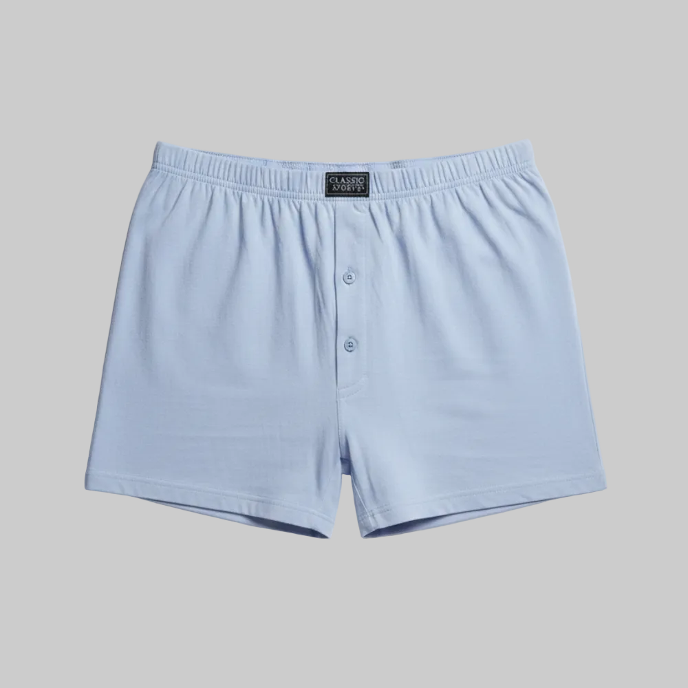 Classic sky blue plain cotton boxer with elastic waistband and button fly, laid flat showing a clean and comfortable everyday design
