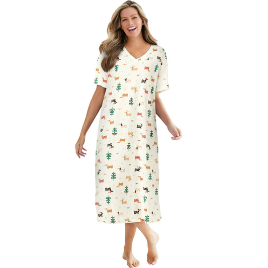 Woman in cream sleepshirt with forest animal and tree print, short sleeves