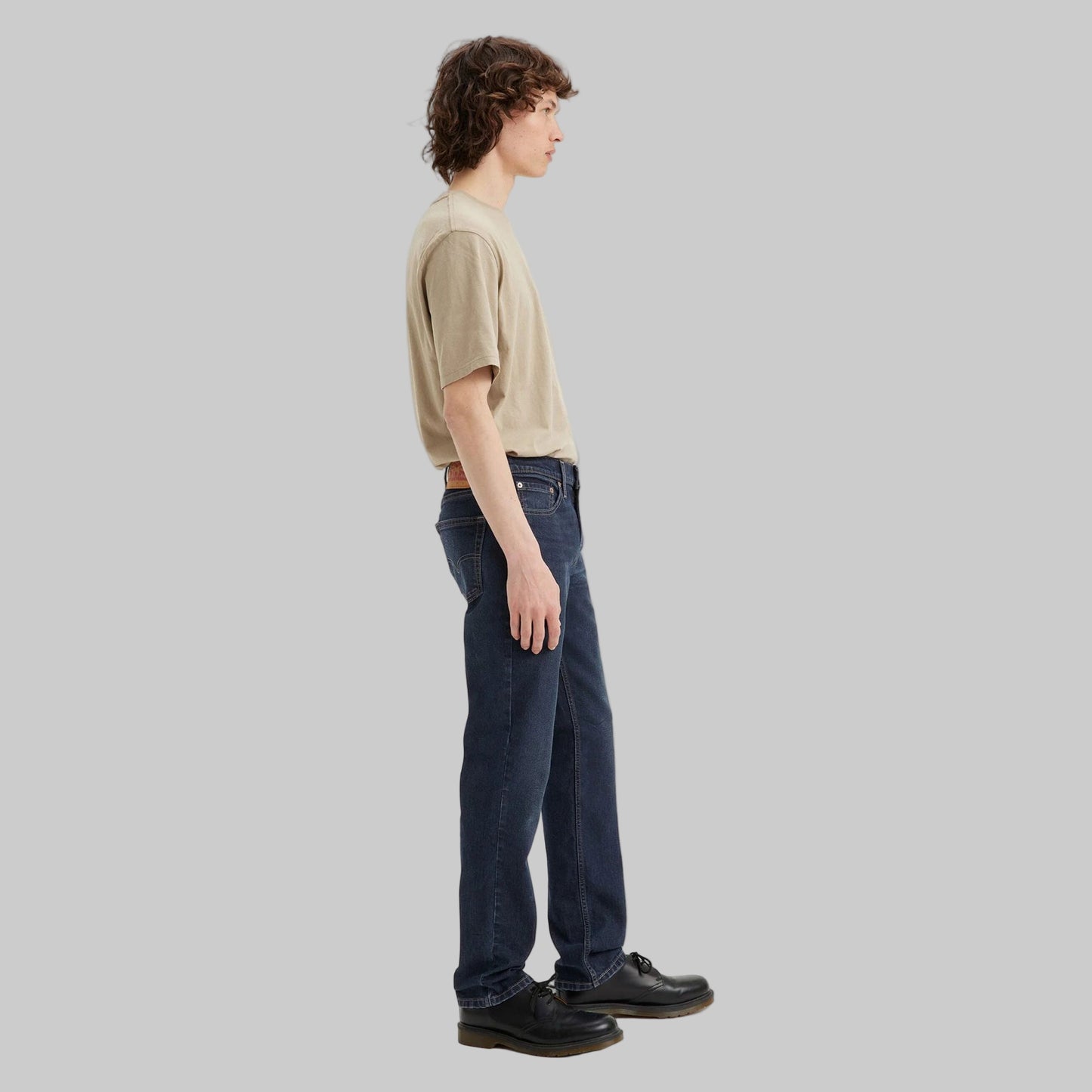 Flat lay of Dark Indigo Signature Slim Straight Jeans in dark indigo wash with high-stretch denim