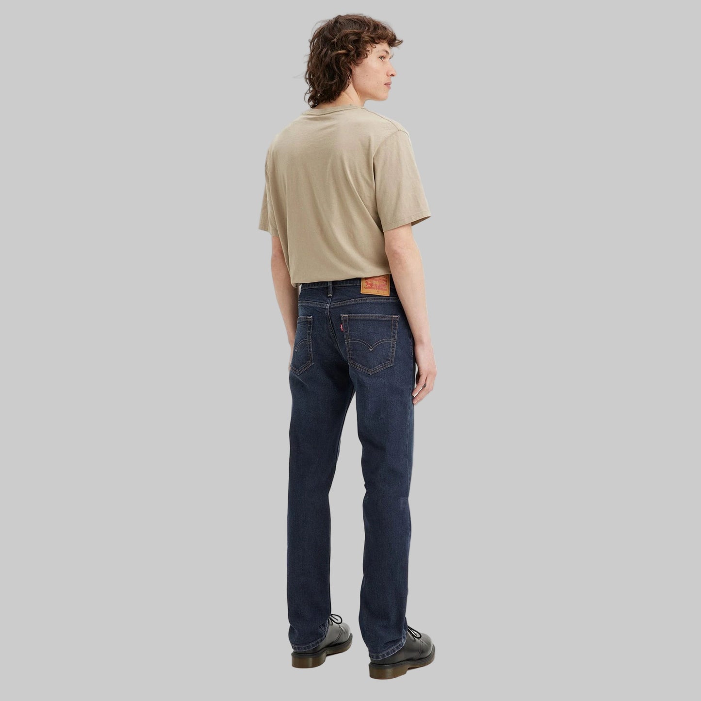 Flat lay of Dark Indigo Signature Slim Straight Jeans in dark indigo wash with high-stretch denim