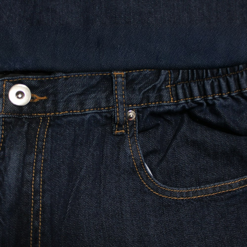 "Men’s dark wash elasticated waist jeans with straight leg, button and zip fastening, belt loops, and front and rear pockets in 100% cotton denim."
