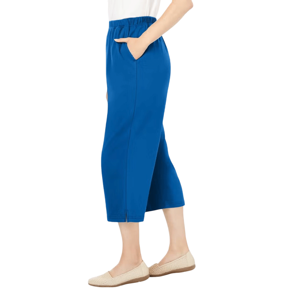 A woman wearing Deep Cobalt 7-Day Knit Capri Pants, featuring a relaxed fit, elastic waistband, and soft knit fabric, ideal for everyday wear.