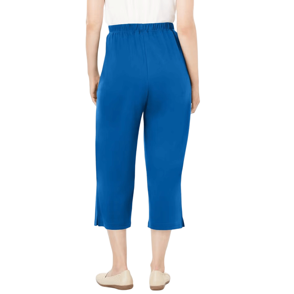 A woman wearing Deep Cobalt 7-Day Knit Capri Pants, featuring a relaxed fit, elastic waistband, and soft knit fabric, ideal for everyday wear.