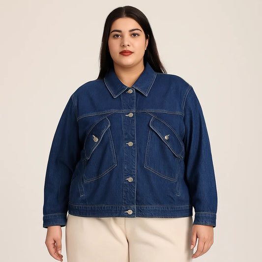 Plus-size woman wearing indigo denim jacket with oversized utility pockets and button front