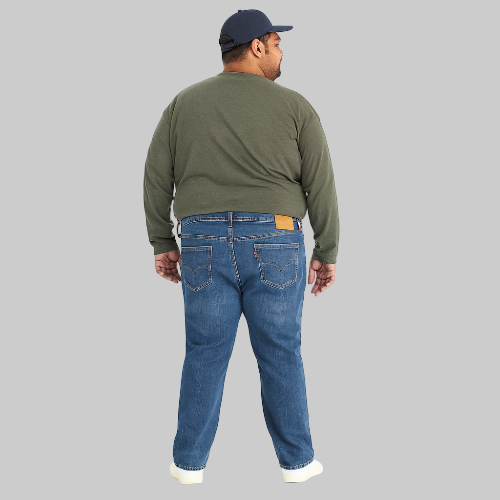 Glowing Medium Wash Classic Stretch Jeans with straight-leg cut, zip fly, and 5-pocket styling in stretch denim.