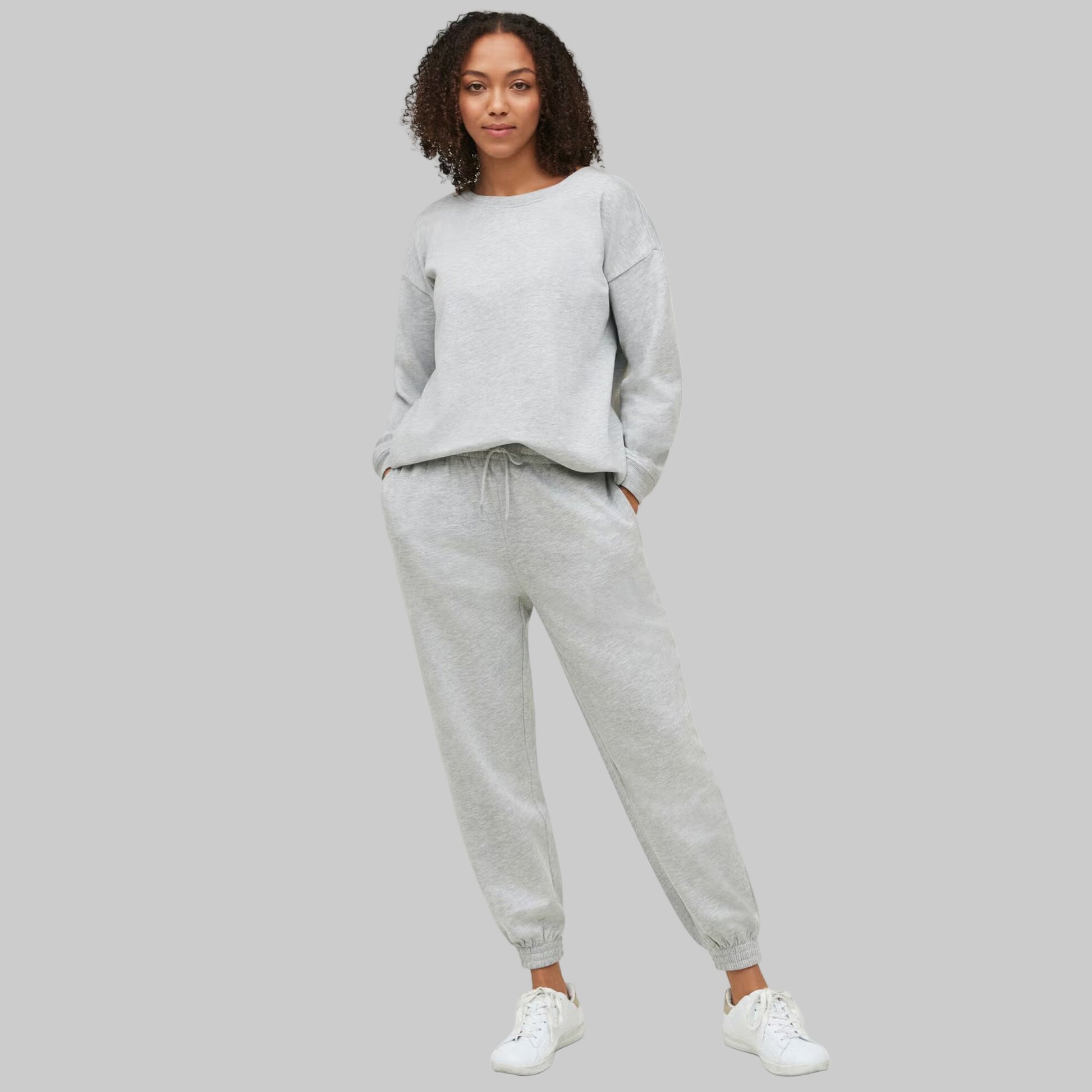 Plus-size woman wearing Heather Grey Fleece Jogger Sweatpants with drawstring waist