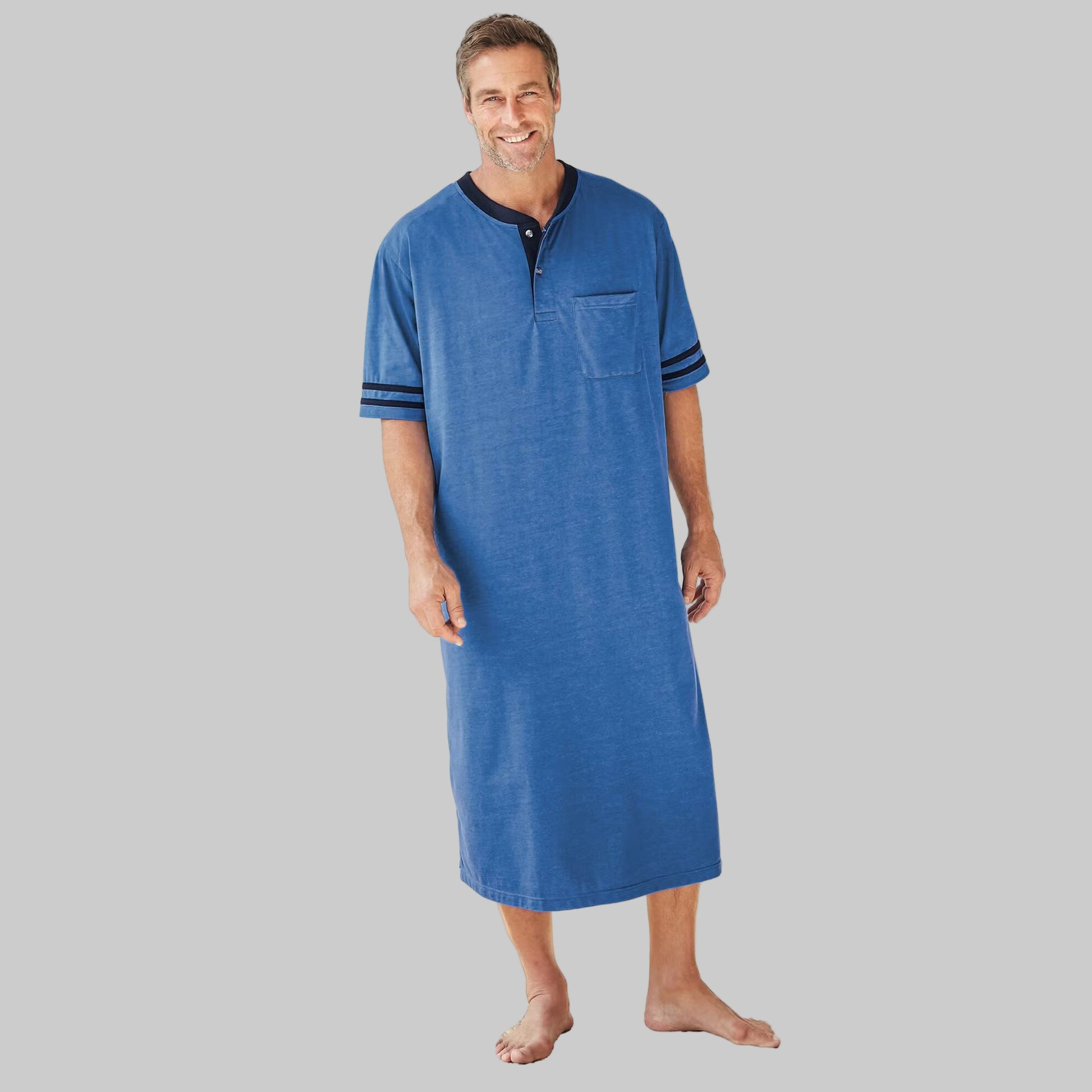 Plus size woman wearing a Heather Soft Blue Short Sleeve Henley Nightshirt with striped sleeves, chest pocket, and two-button placket.