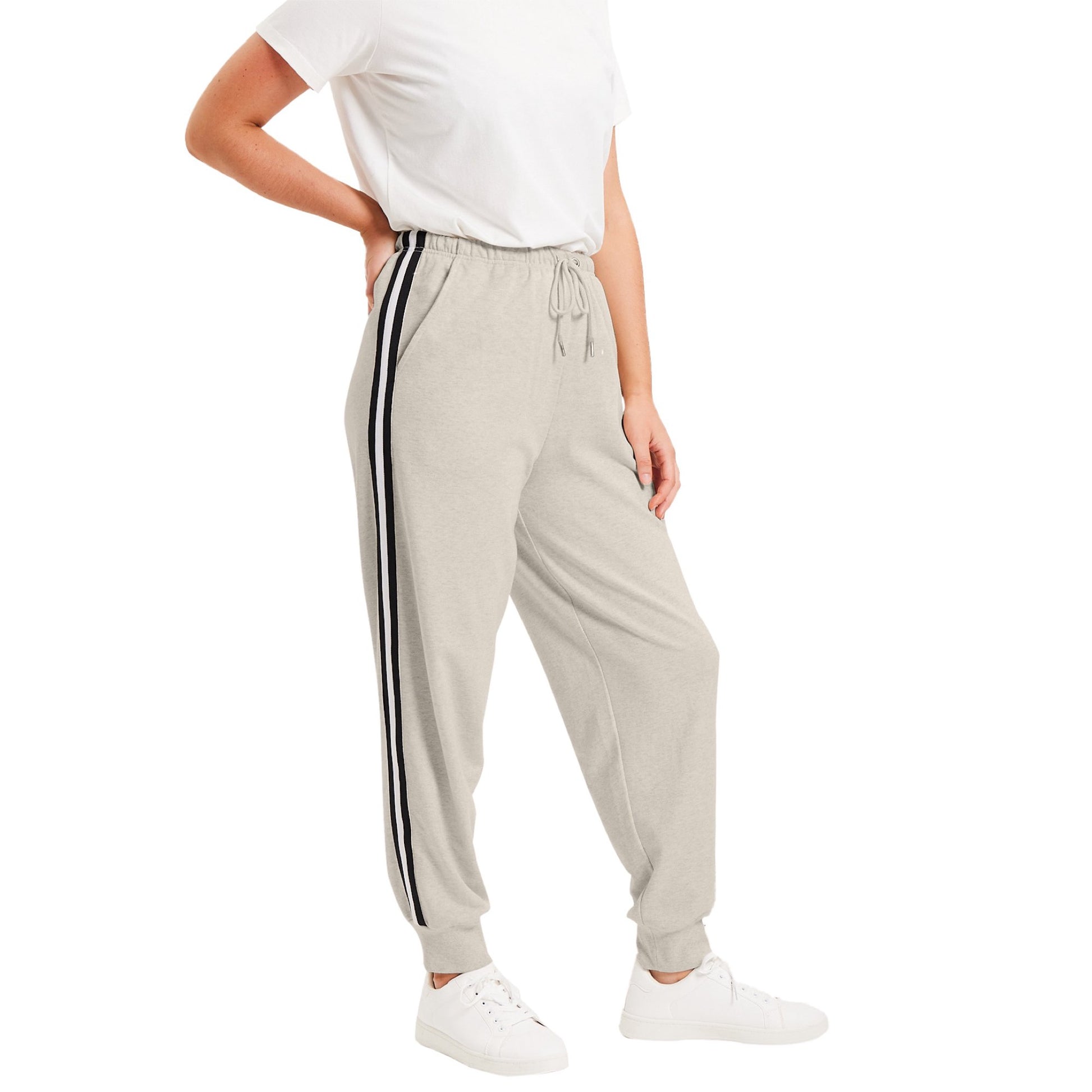 Plus size woman wearing Heather Oatmeal French Terry joggers with black side stripes
