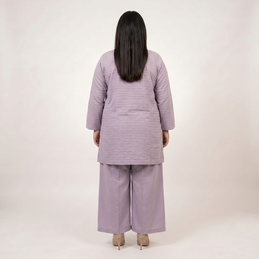Front view of a woman wearing a Lavender Mist Co-Ord Set featuring a solid lavender textured tunic with an embellished neckline and matching wide-leg trousers.