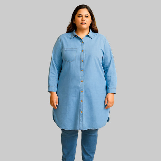 Plus-size model wearing Light Denim Longline Button-Down Shirt Tunic in a shopping mall setting