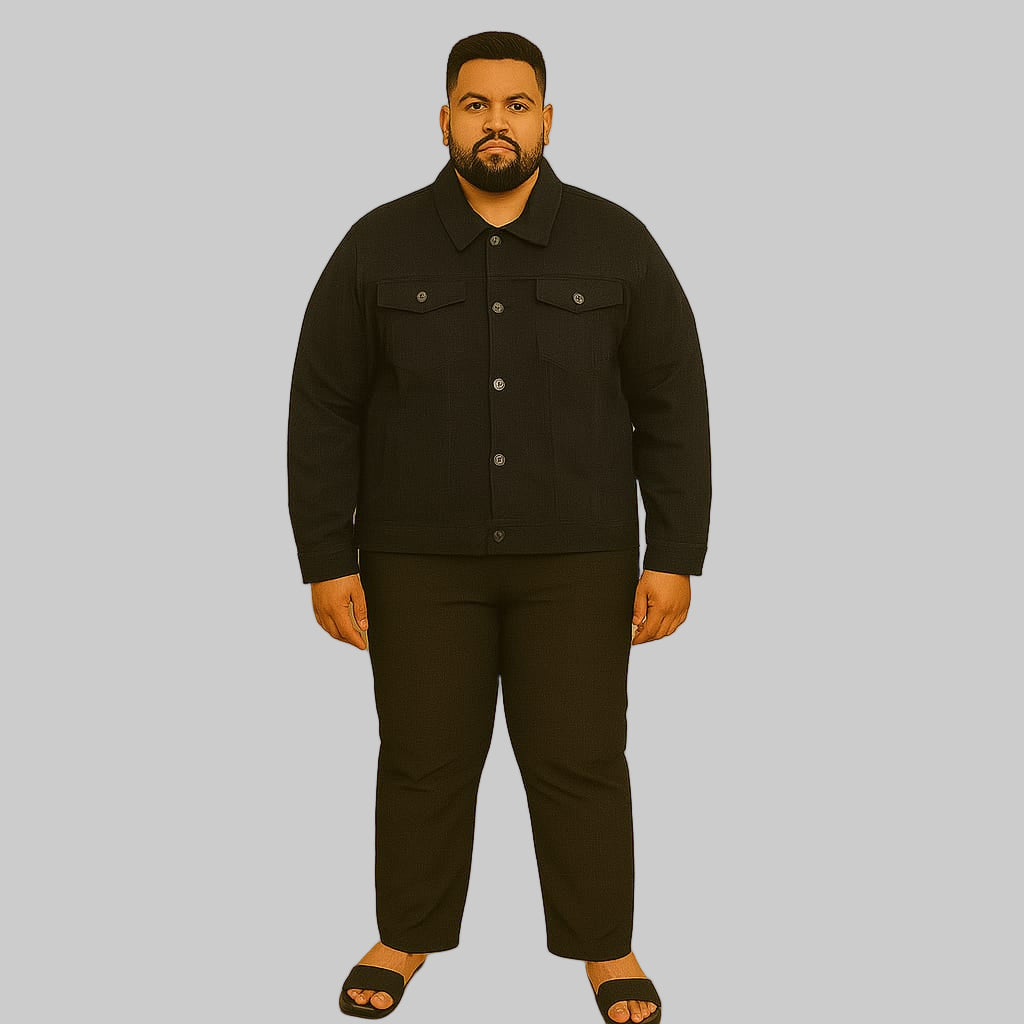Plus-size man wearing black denim jacket with button front and flap chest pockets
