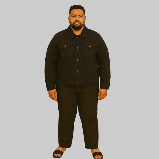 Plus-size man wearing black denim jacket with button front and flap chest pockets