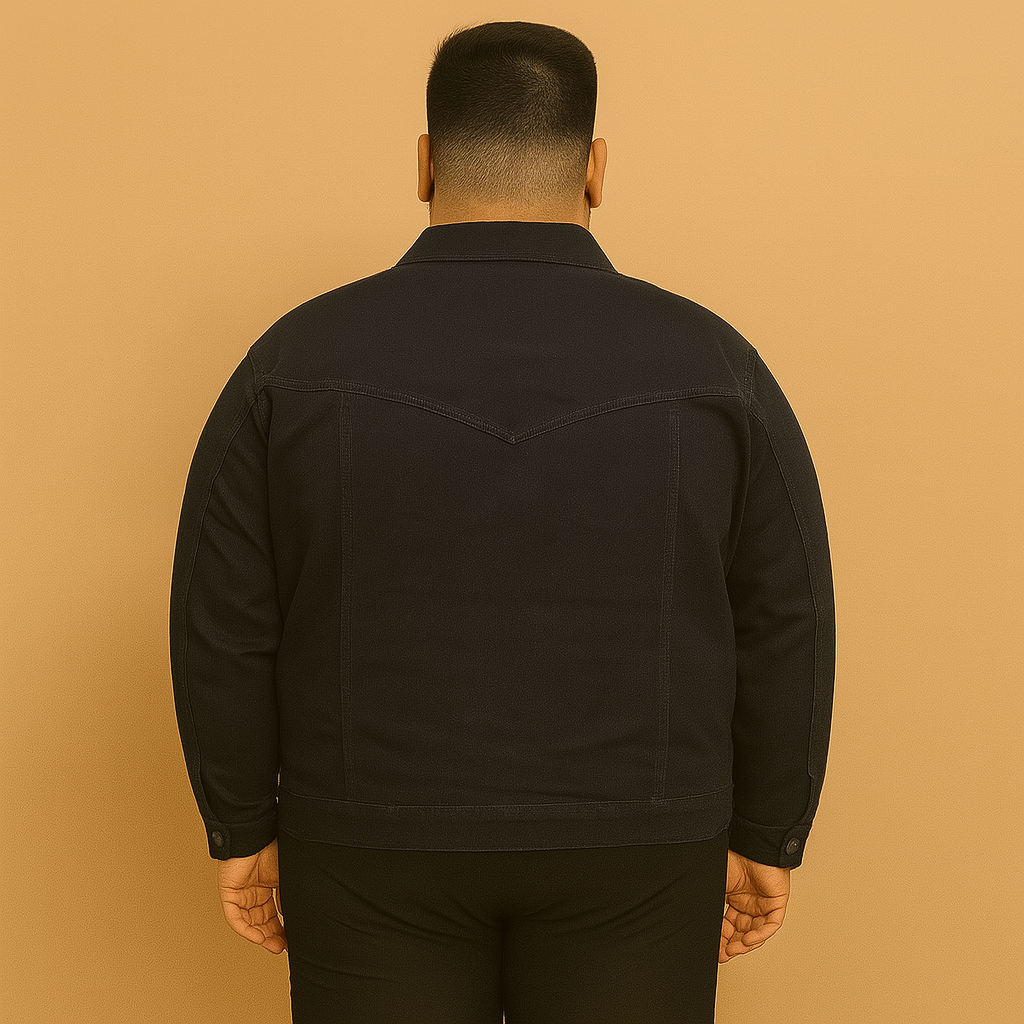 Plus-size man wearing black denim jacket with button front and flap chest pockets