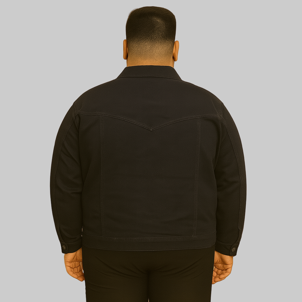 Plus-size man wearing black denim jacket with button front and flap chest pockets
