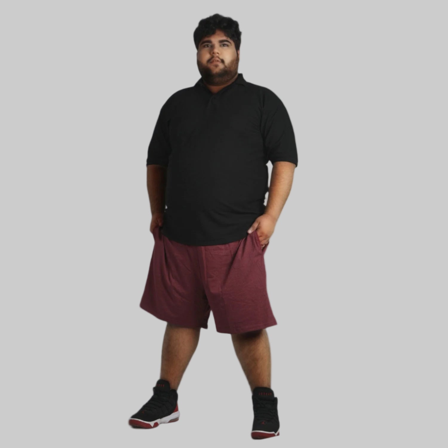 A pair of Maroon Lightweight Jersey Big Size Shorts with a soft jersey fabric, elastic waistband, and adjustable drawstring for a comfortable and stylish fit