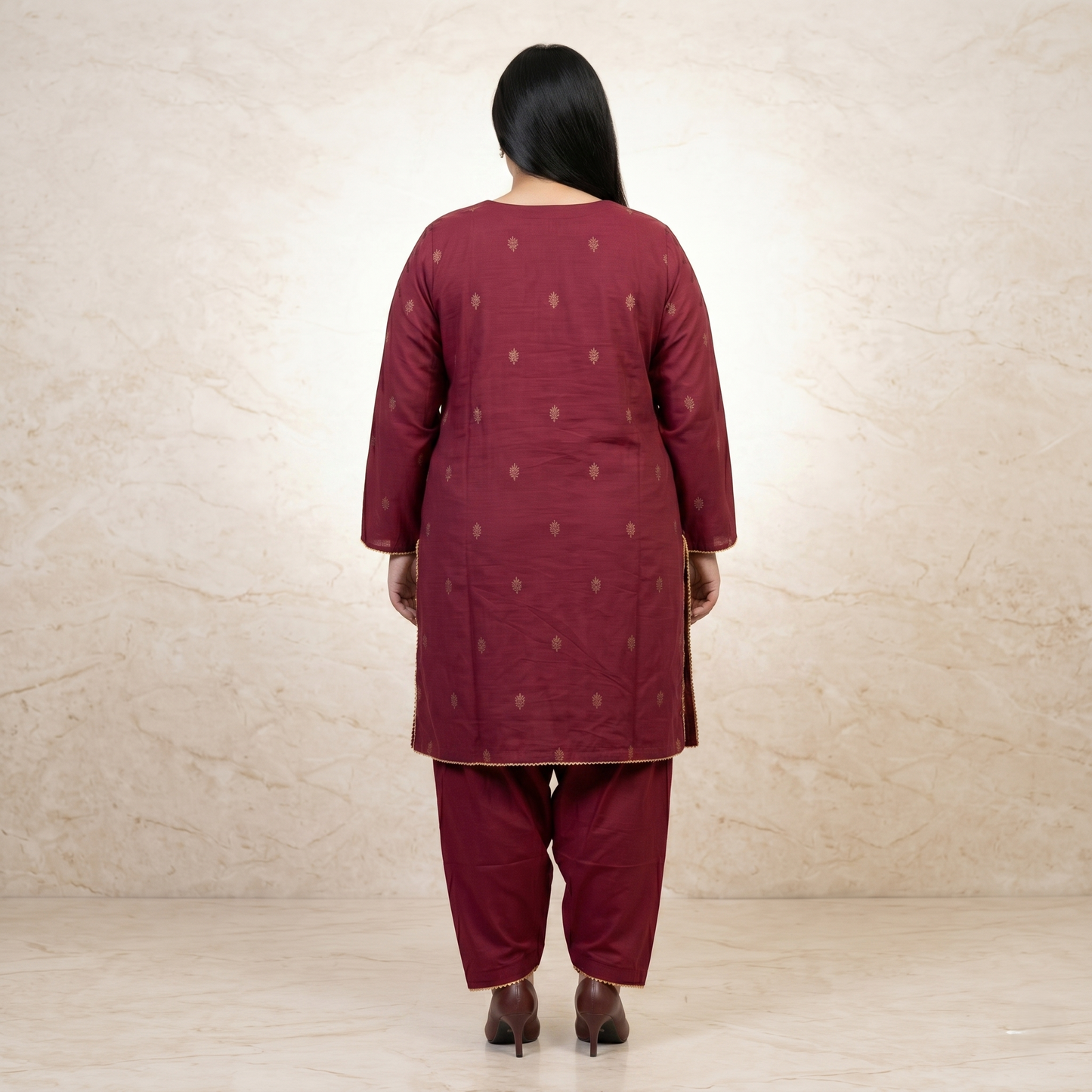 Maroon traditional outfit with matching pants on a beige background