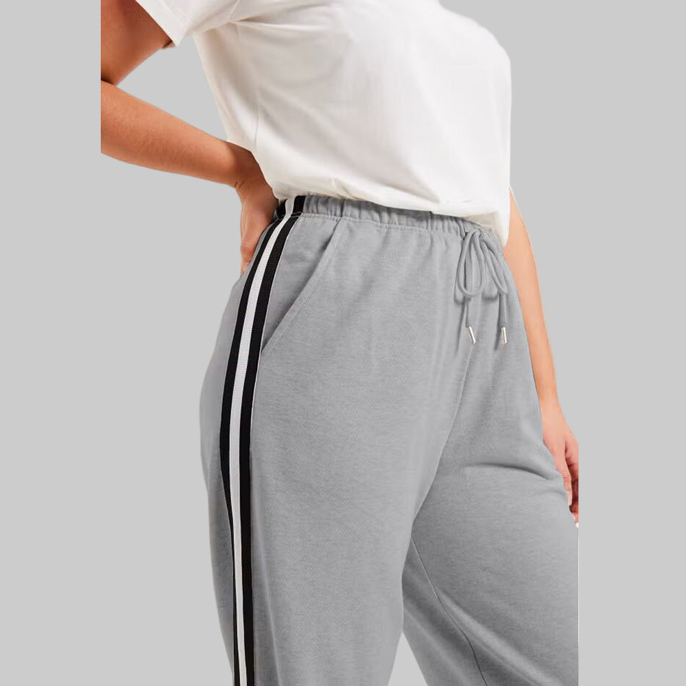Medium Heather Grey French Terry Joggers with side stripe detailing, drawstring waist, and ribbed cuffs — slim-fit plus size lounge joggers for women.