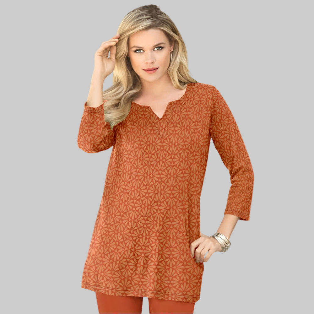 Plus-size soft knit tunic with a stitched notch neckline, three-quarter sleeves, side slits, and a relaxed fit. Made from a breathable cotton/poly blend.