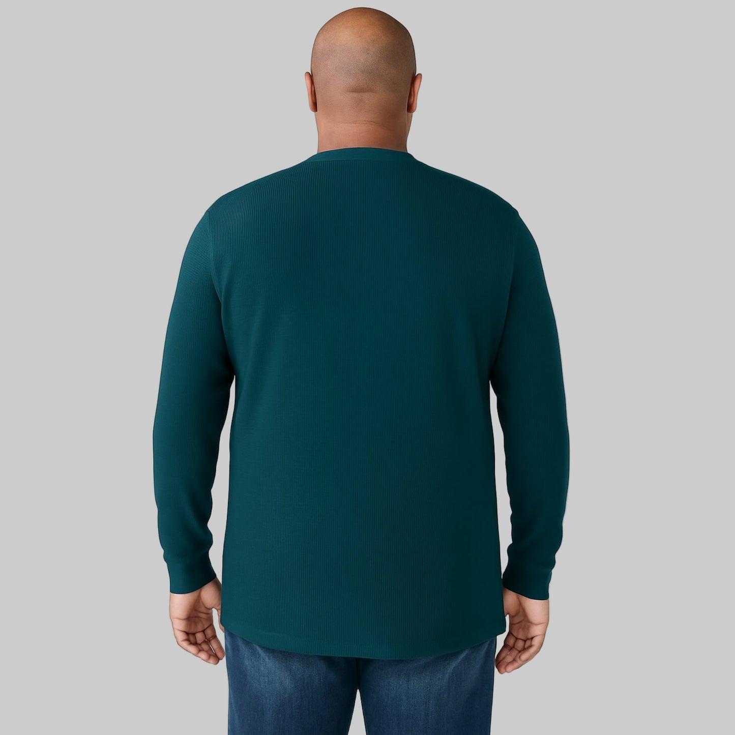 Model wearing midnight teal waffle-knit thermal Henley tee with ribbed cuffs and five-button placket against a plain white background.