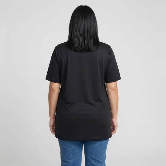Person wearing a black t-shirt and blue jeans on a plain background