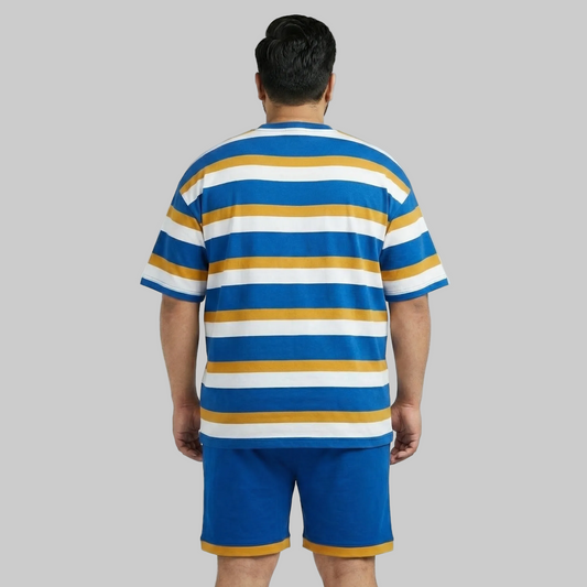 Person wearing a blue, yellow, and white striped shirt with matching shorts on a gray background
