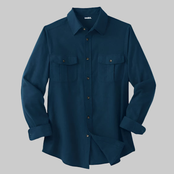 Navy blue solid flannel shirt with horn buttons and flap chest pockets, made from double-brushed cotton.